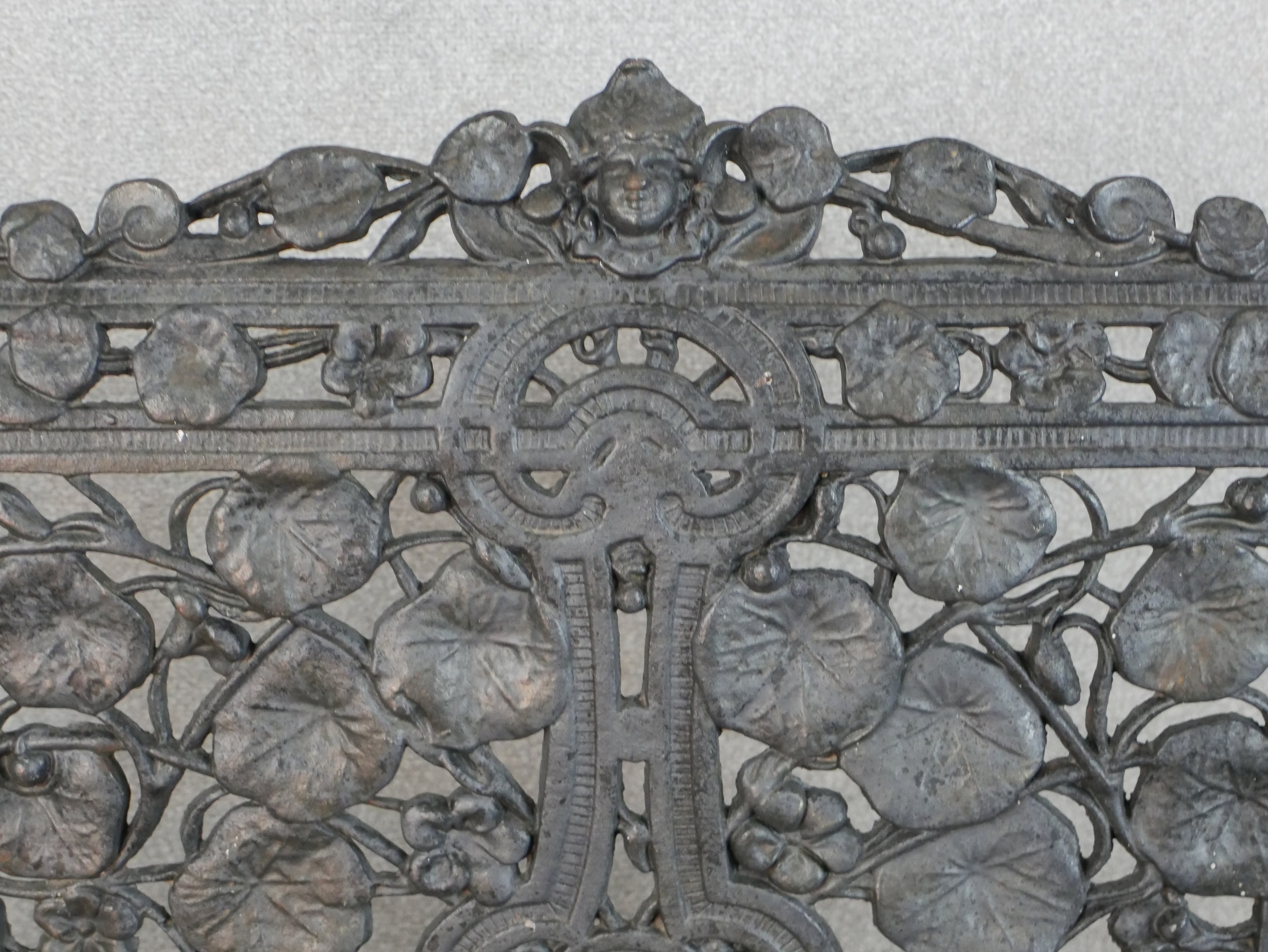 A Victorian Coalbrookdale style cast iron garden bench, in nasturtium pattern, missing one seat - Image 5 of 9