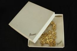 A boxed vintage Grosse Christian Dior gilt ivy leaf design articulated statement necklace. Each leaf