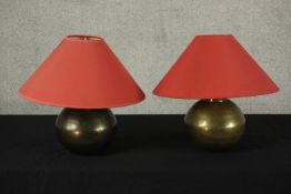 A pair of contemporary spherical brass table lamps each with red shades. H.40 Dia.41cm. (each)