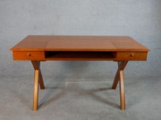A contemporary probably French cherrywood writing table, the rectangular top with a retractable