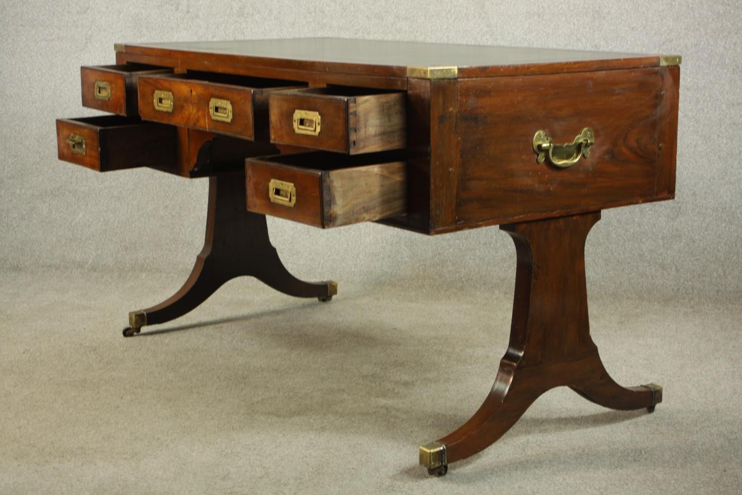 A contemporary mahogany Chinese style leather inset writing table with brass campaign style - Image 7 of 12