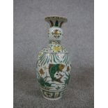 A Chinese porcelain baluster vase decorted with fish swimming in the sea, with six character mark