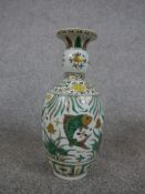 A Chinese porcelain baluster vase decorted with fish swimming in the sea, with six character mark