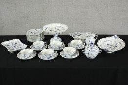 An assortment of Royal Copenhagen Blue fluted half lace pattern blue and white porcelain to