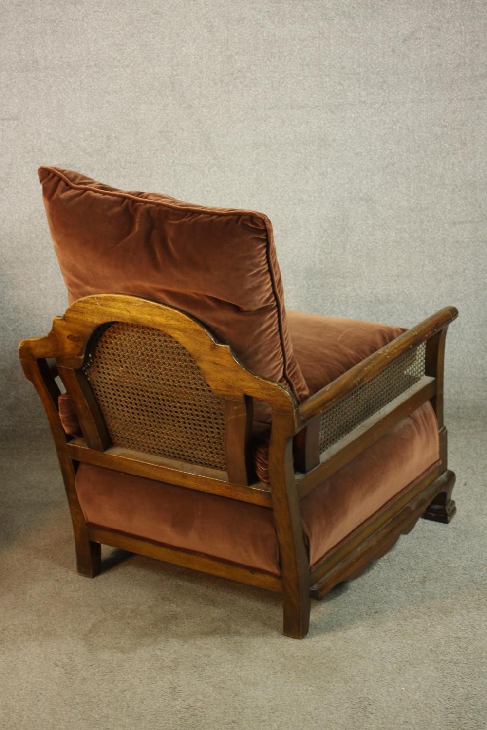 A pair of early 20th century carved mahogany framed and bergère armchairs, each with scroll arms and - Image 7 of 9