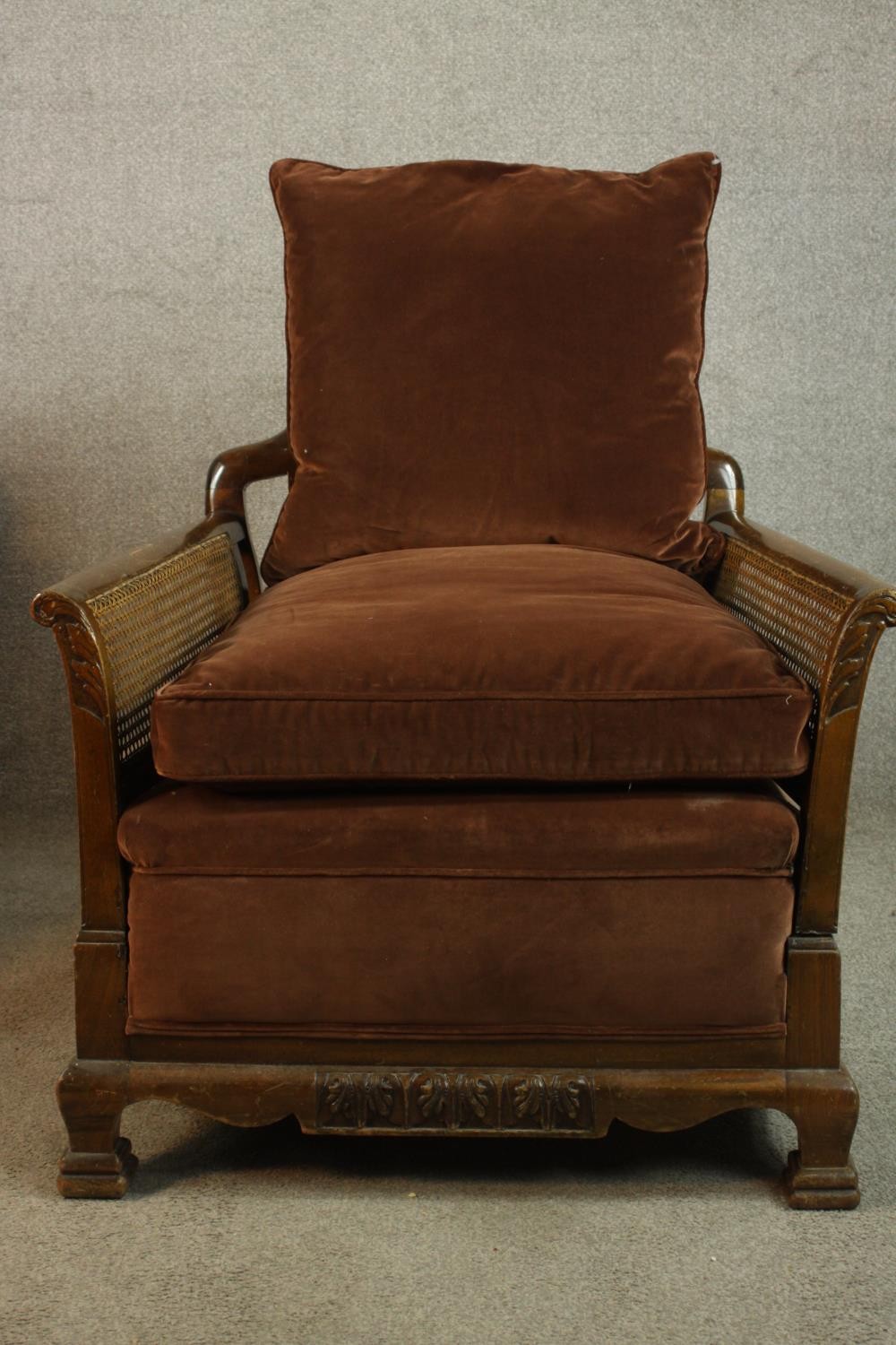 A pair of early 20th century carved mahogany framed and bergère armchairs, each with scroll arms and - Image 3 of 9