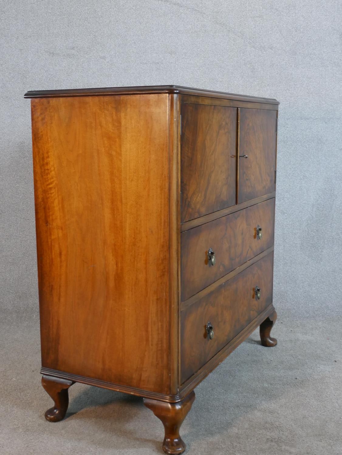 A circa 1930s figured walnut side cabinet, with two cupboard doors enclosing a shelf, over two - Image 5 of 5