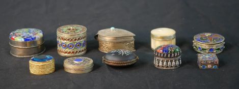 Ten Oriental pill and trinket boxes, one silver and enamel with floral design. H.3.5 W.4.5cm (