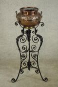 A late 19th / early 20th century copper planter, embossed with fluted decoration raised on painted