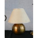 Four assorted decorative table lamps to include a fluted brass lamp raised on domed foot and a