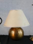 Four assorted decorative table lamps to include a fluted brass lamp raised on domed foot and a