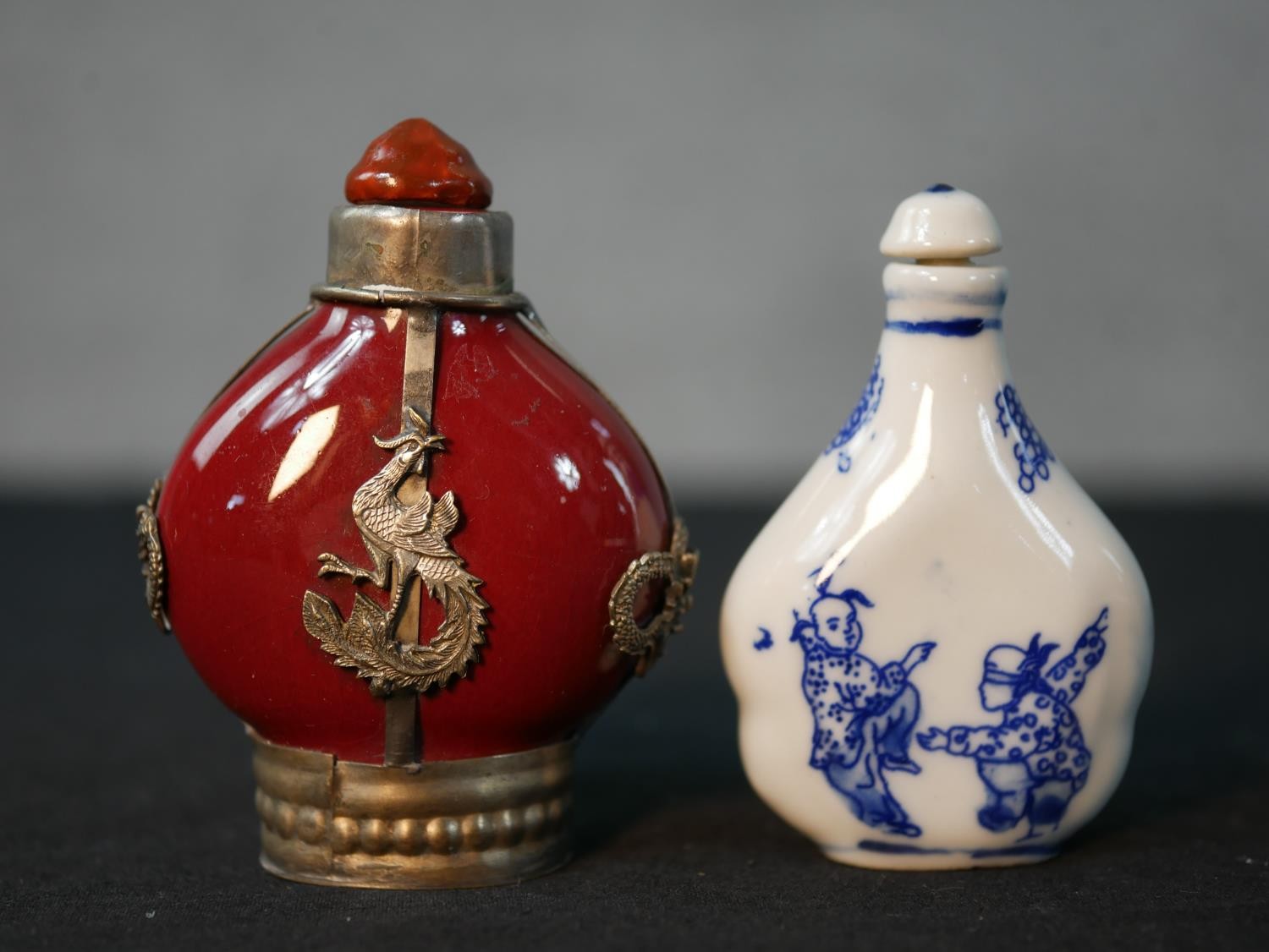 Four 20th century Chinese snuff bottles, one white porcelain with blue figural printed design, a - Image 5 of 6