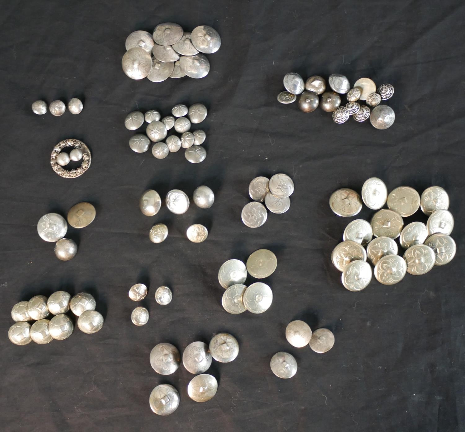 A large collection of fifty plus Danish, silver, white metal and pewter folk costume buttons, some