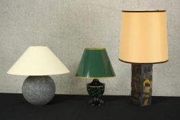 Three table lamps, including a malachite pattern lacquered metal table lamp with green shade, a