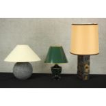 Three table lamps, including a malachite pattern lacquered metal table lamp with green shade, a