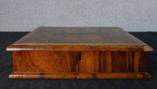 A late 17th / early 18th century walnut and oyster veneered hinge lidded box. H.6.5 W.27.5 W.22cm