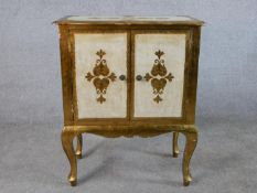 An 20th centrury painted Florentine style two door cabinet raised on shaped cabriole supports