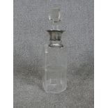 A George V hallmarked silver collared glass decanter, with applied silver Whiskey decanter /