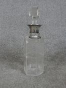A George V hallmarked silver collared glass decanter, with applied silver Whiskey decanter /