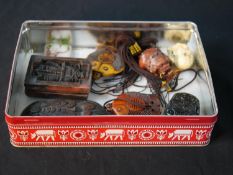 A collection of eight Chinese resin and glass netsukes, snuff bottles and talismans. Various