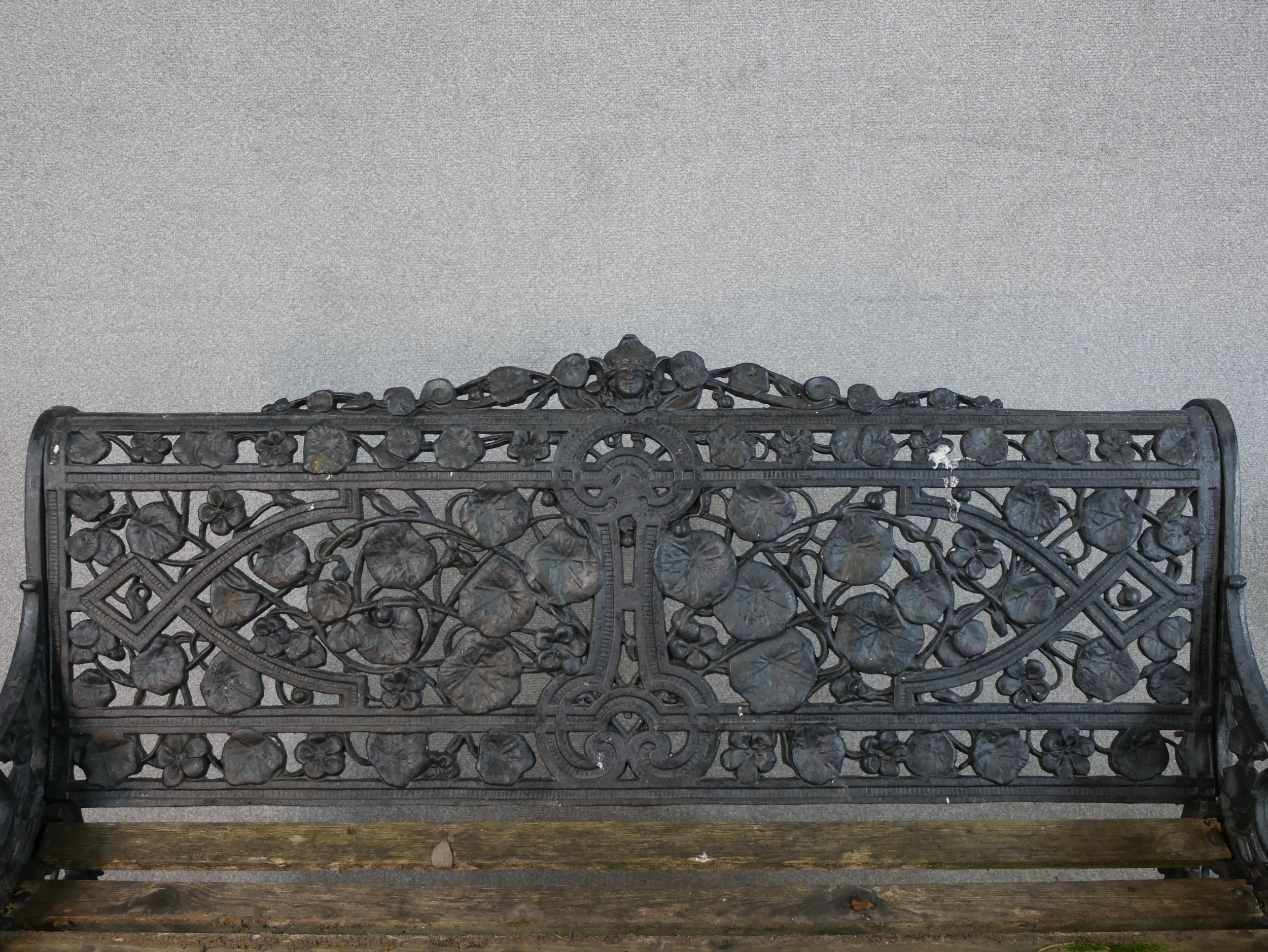 A Victorian Coalbrookdale style cast iron garden bench, in nasturtium pattern, missing one seat - Image 4 of 9