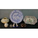An assortment of 20th century pottery to include Quimper octagonal plate decorated with a farmer,