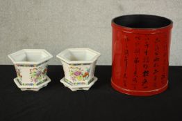 A pair of Halcyon Days painted porcelain hexagonal planters and stands decorated with flowers,