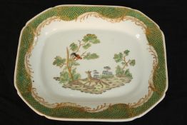 A 20th century Chinese octagonal porcelain plate, decorated with a fox and a bird within a green and