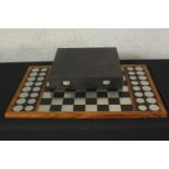 A contemporary modernist design brushed steel magnetic chess set complete with board by Christie