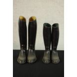 A pair of Aigle black leather riding boots; size XL together one other pair of black riding boots.