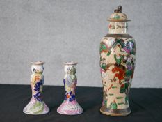 A 20th century Chinese porcelain crackle glaze jar and cover decorated with fighting scene; the