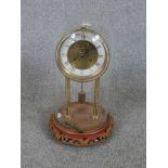 A 20th century Richard et Cie (Richard & Co) brass anniversary / mystery clock, the white and