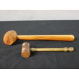 A 20th century walnut turned auctioneers gavel together with a turned brass auctioneers gavel. L.