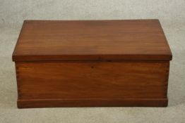 A mid 20th century teak twin brass handled carrying box with hinged lid opening on plinth base. H.35