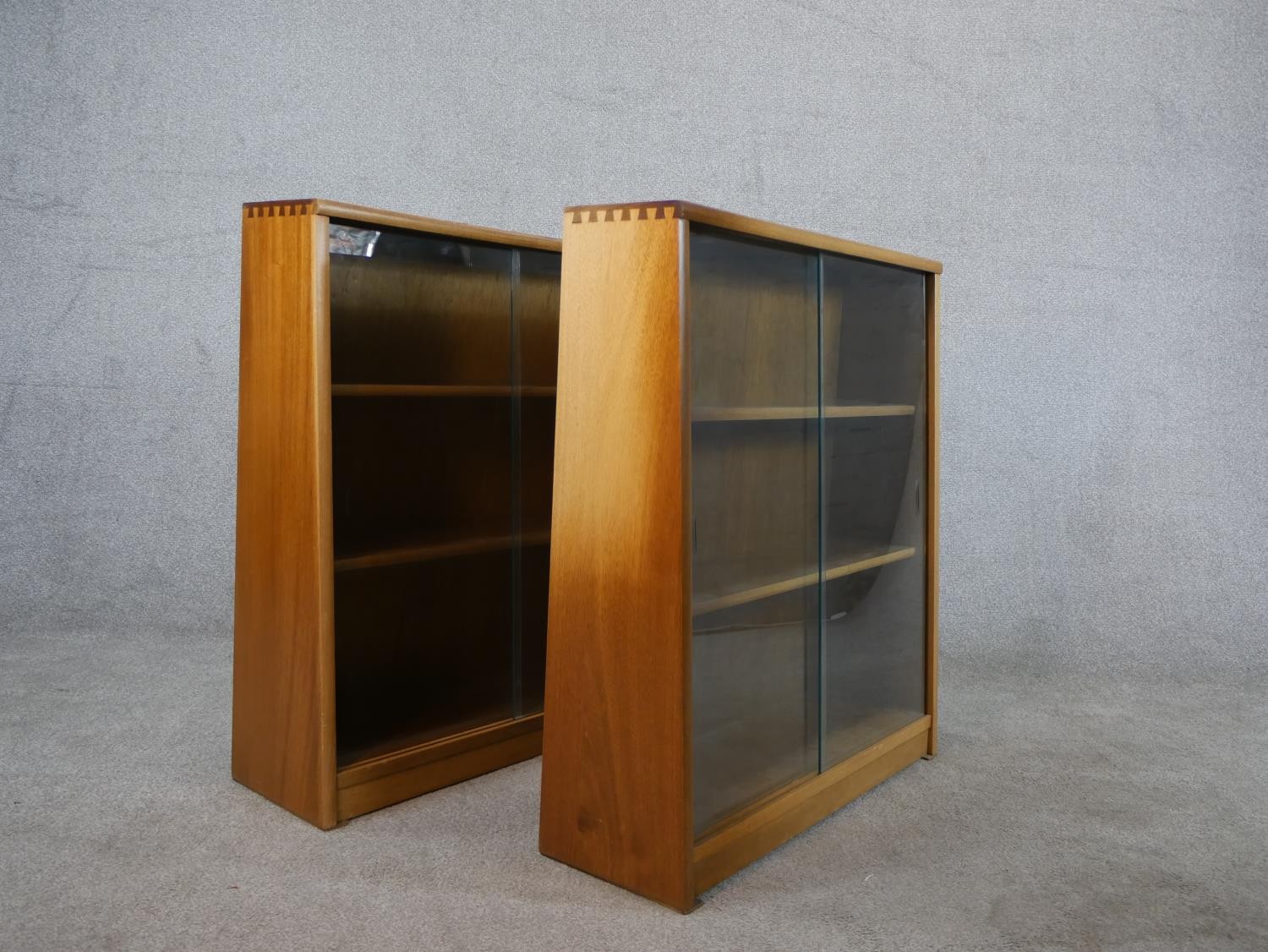 A pair of circa 1970s Jonell bookcases, with a pair of glass sliding doors enclosing shelves, on a - Image 6 of 8