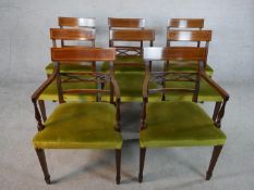 A set of eight Regency mahogany framed dining chairs with pierced bar back, green upholstered