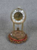 A 20th century Richard et Cie (Richard & Co) brass anniversary/mystery clock, the white and brass