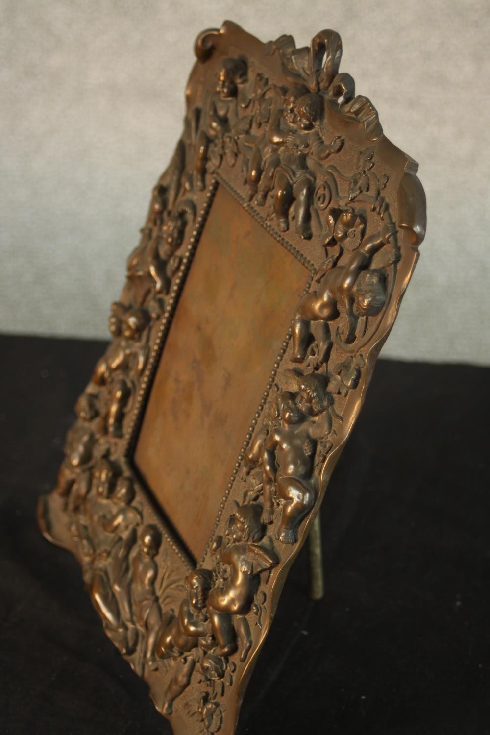 A late 19th/early 20th, possibly Italian cast bronze easel picture frame, with fiigural and putti - Image 6 of 10