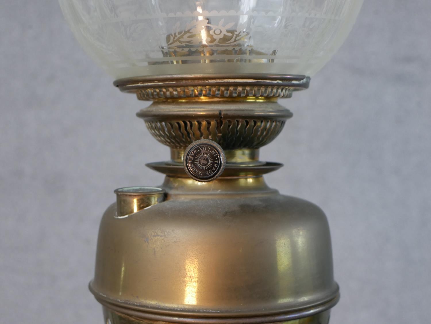 Three Victorian brass oil lamps, one with a spherical etched glass shade and a glass funnel, on an - Image 4 of 16