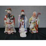 Three Chinese polychrome porcelain Immortal figures, together a Chinese blanc de Chine porcelain