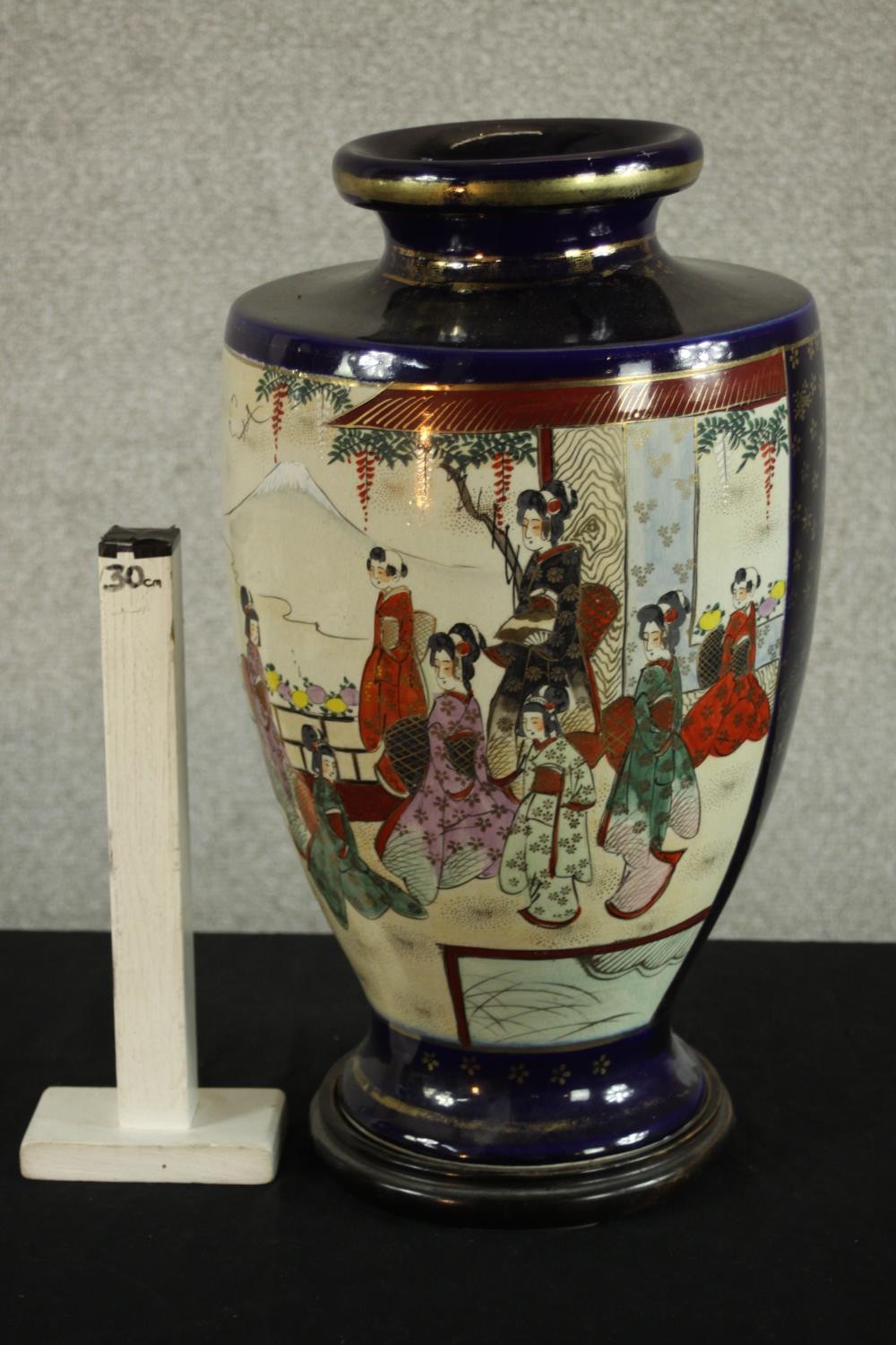 A mid Japanese Satsuma pottery vase, decorated with figures in a temple with Mount Fuji behind, - Image 2 of 6