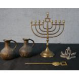 An assortment of brassware to include a menorah; set with central Star of David, a silver plated '