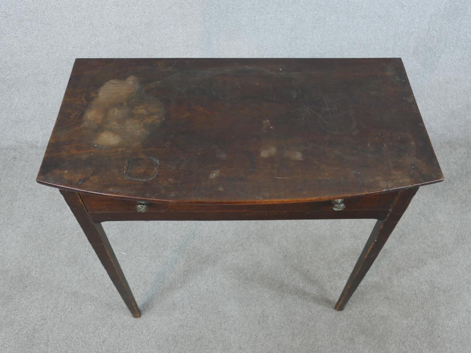 An 18th century mahogany bow fronted side table, with single long drawer on square tapering legs. - Image 2 of 5