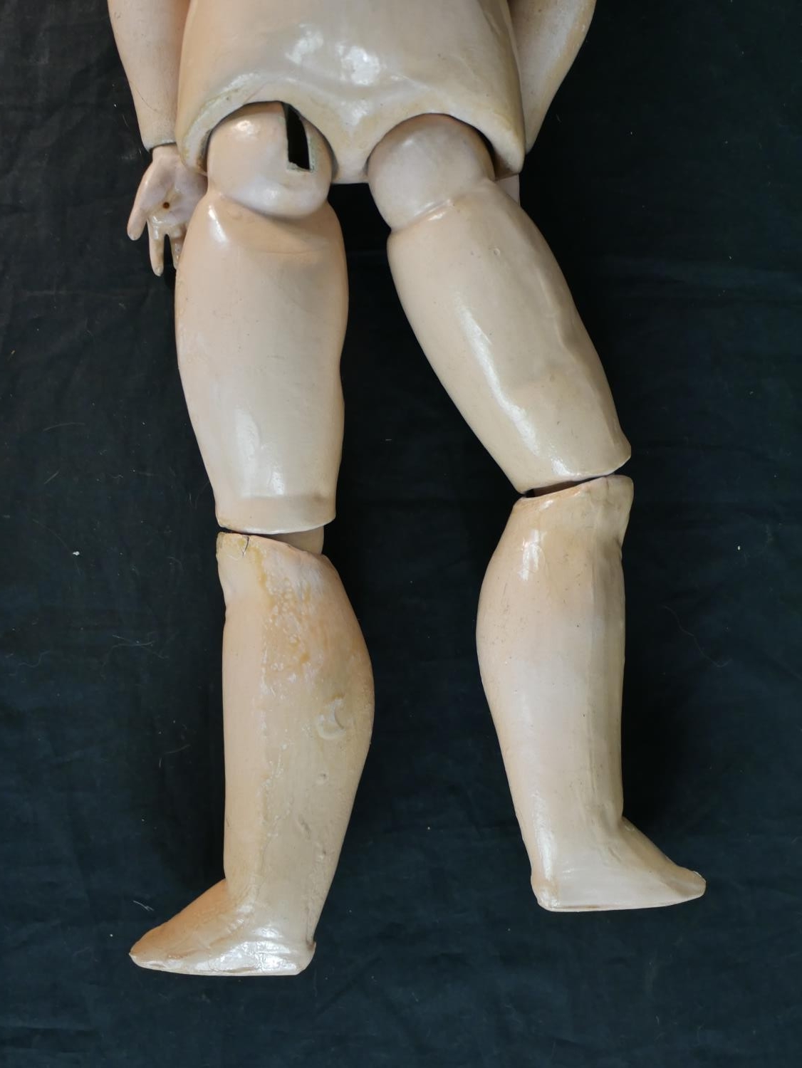 An early 20th century C. M. Bergmann bique porcelain headed composition articulated doll, - Image 5 of 7