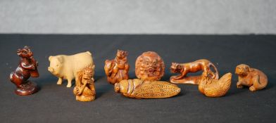 Nine assorted 20th century carved boxwood Japanese netsuke comprised of Hare, Pig, Dragon, Rat,