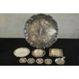 A collection of silver plate and pewter, including three pierced design butter dishes, a taste de