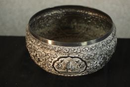 A late 19th / early 20th century Siamese white metal, probably silver bowl embossed with various