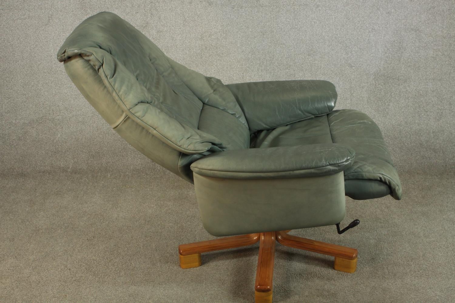 A 20th century pale green leather swival and counter leaver arm chair raised on five splayed - Image 7 of 8