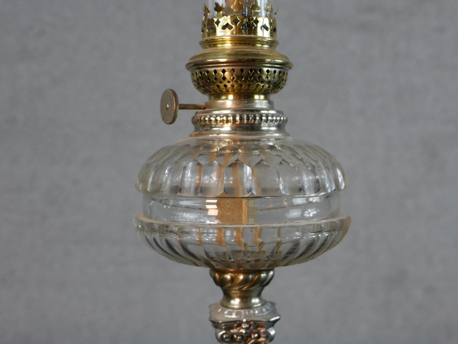 Three Victorian brass oil lamps, one with a spherical etched glass shade and a glass funnel, on an - Image 15 of 16