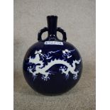 A Chinese blue and white porcelain twin handled moon flask with five claw dragon and pheonix